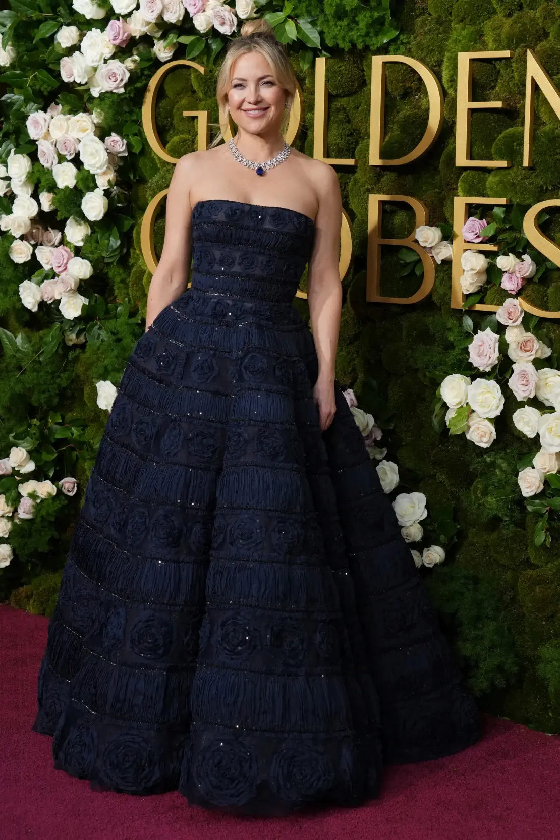 Kate Hudson wearing a navy strapless Carolina Herrera ballgown