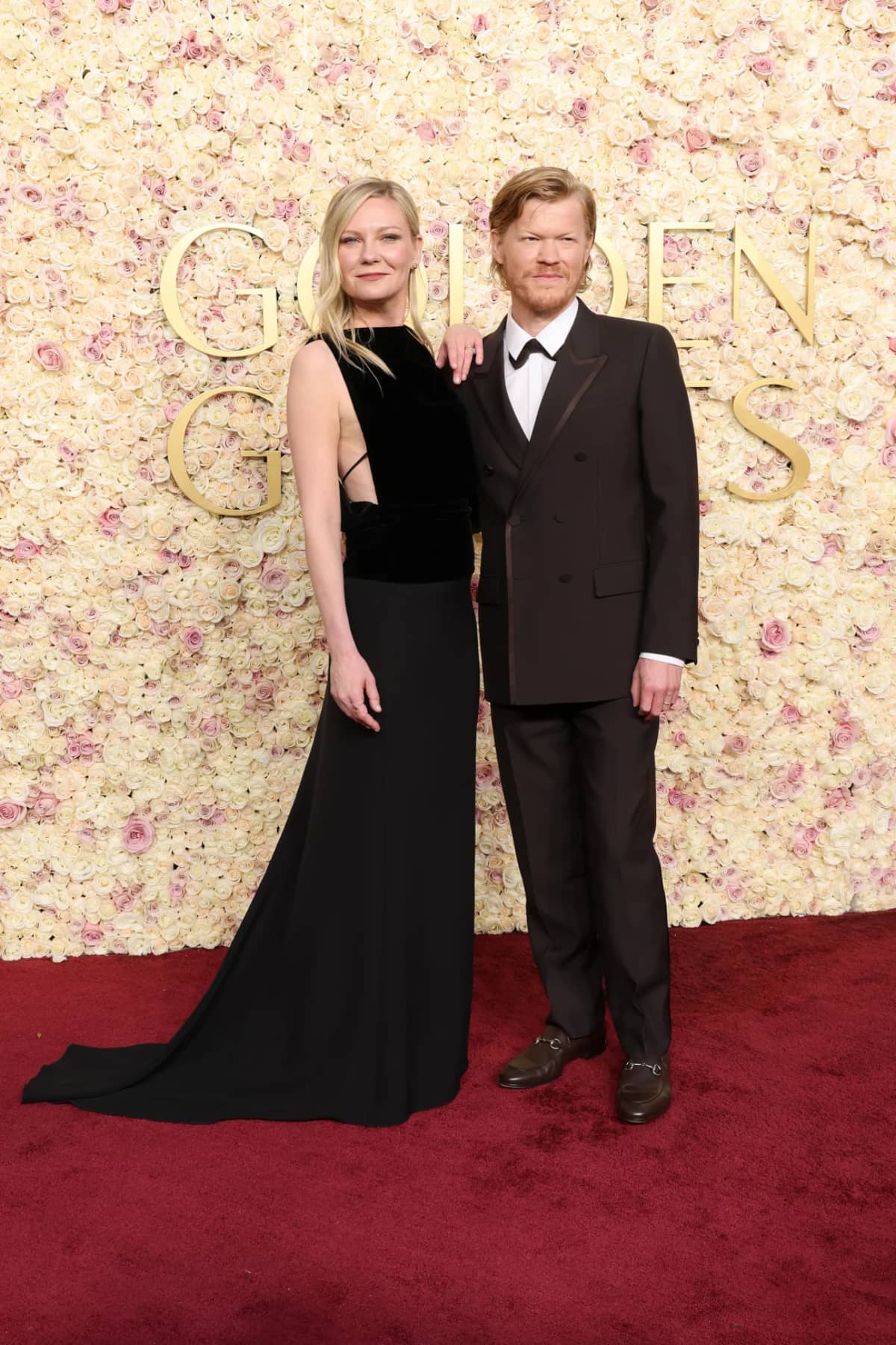 Kirsten Dunst and Jesse Plemons, both in Gucci. Dunst's drop-waist dress was inspired by the 1930s, while Plemon's wore a brown wool double-breasted suit and Horsebit loafers