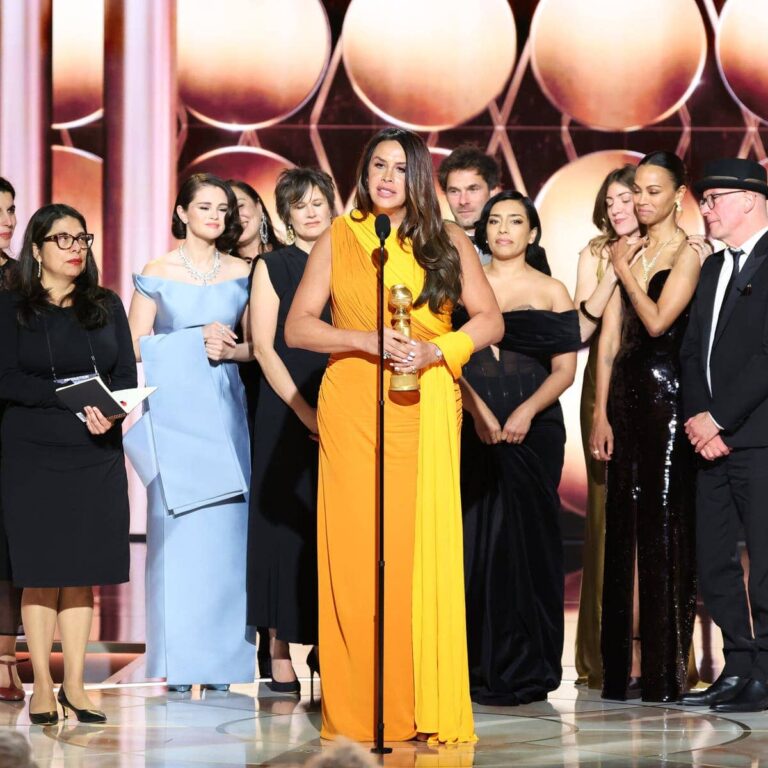 The actress Karla Sofía Gascón, center, accepts the best picture, musical or comedy award for “Emilia Pérez”