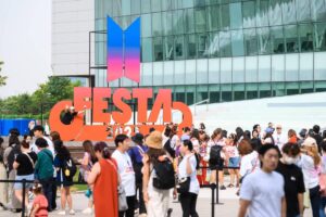 Fans wait in line to enter the 2025 BTS Festa event at Kintex in Goyang Gyeonggi Province on Friday