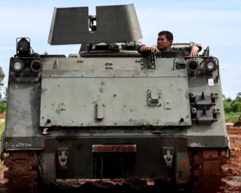 A Thai soldier is seen in an Armoured Personnel Carrier (APC) on a road near the Thailand-Cambodia's border in Thailand's Sisaket province on Tuesday