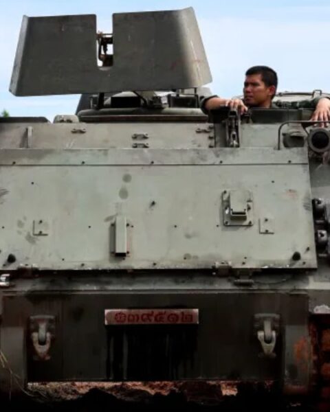 A Thai soldier is seen in an Armoured Personnel Carrier (APC) on a road near the Thailand-Cambodia's border in Thailand's Sisaket province on Tuesday