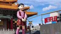 A giant killer doll, among other motifs of Squid Game, were part of a parade celebrating the show's final season
