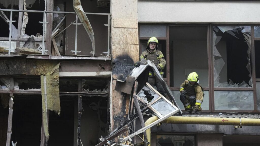 Firefighters work in a destroyed apartment building after a Russian attack in Kyiv, Ukraine, July 21, 2025.