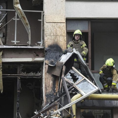 Firefighters work in a destroyed apartment building after a Russian attack in Kyiv, Ukraine, July 21, 2025.