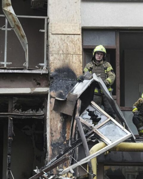 Firefighters work in a destroyed apartment building after a Russian attack in Kyiv, Ukraine, July 21, 2025.