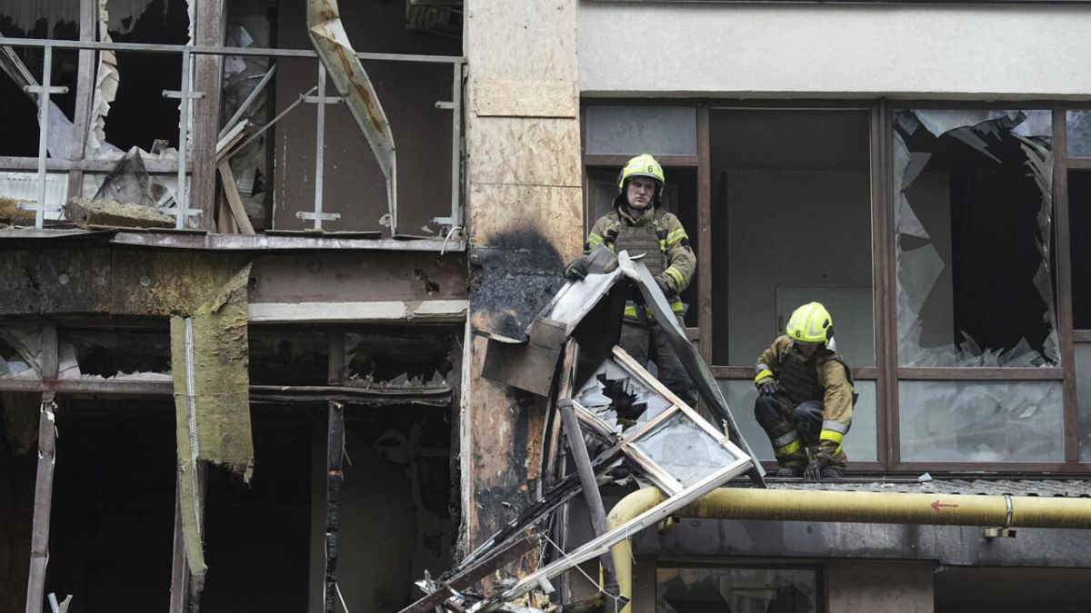 Firefighters work in a destroyed apartment building after a Russian attack in Kyiv, Ukraine, July 21, 2025.