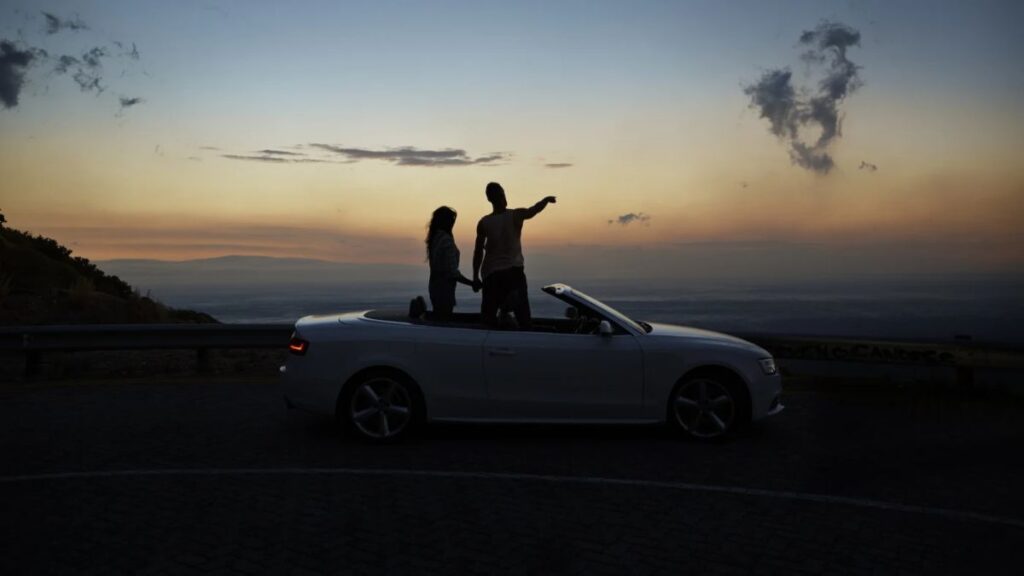 Couple Besides A Car