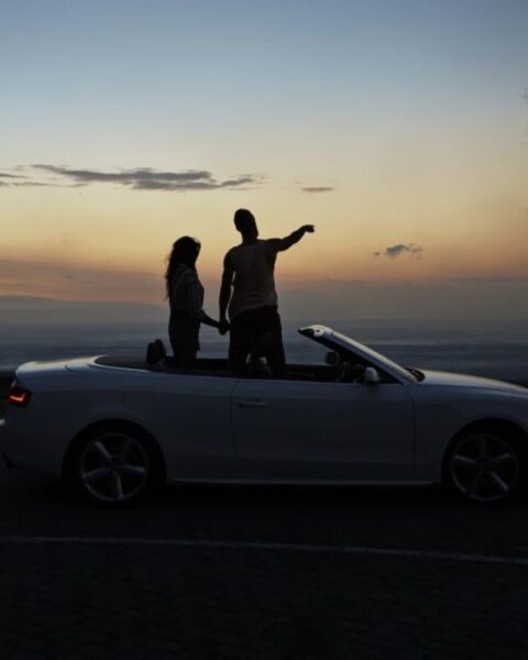 Couple Besides A Car