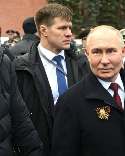 Russian President Vladimir Putin with Bodyguards Around