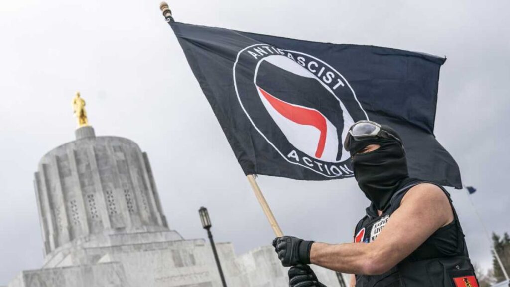 An Antifa Activist Waving Flag