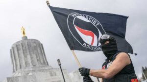 An Antifa Activist Waving Flag
