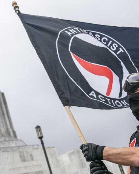 An Antifa Activist Waving Flag