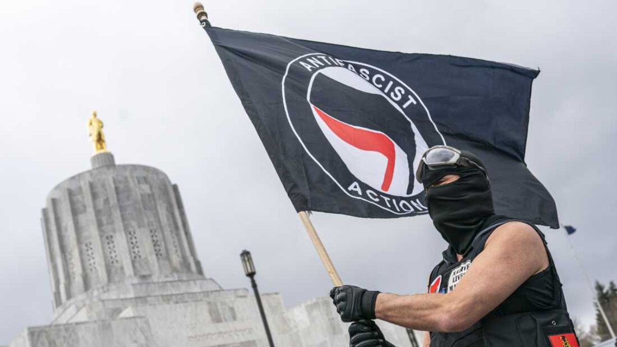 An Antifa Activist Waving Flag