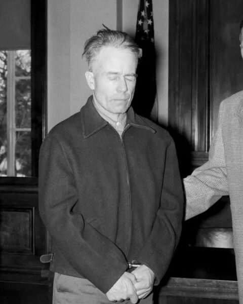Ed Gein stands with his attorney at the Wabsara County Court.