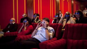 Former President Barack Obama and first lady Michelle Obama wear 3-D glasses during a Super Bowl party in the White House Family Theater in 2009.