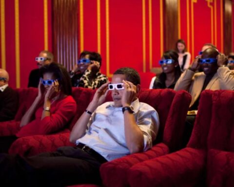 Former President Barack Obama and first lady Michelle Obama wear 3-D glasses during a Super Bowl party in the White House Family Theater in 2009.