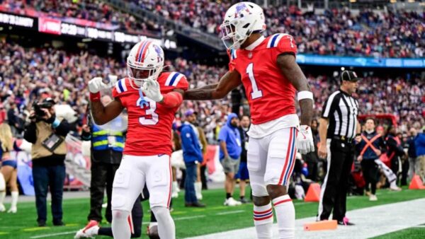DeMario Douglas #3 of the New England Patriots celebrates with teammate Ja'Lynn Polk #1 after scoring a touchdown against the Houston Texans
