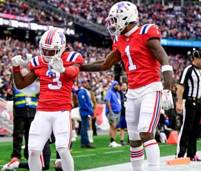 DeMario Douglas #3 of the New England Patriots celebrates with teammate Ja'Lynn Polk #1 after scoring a touchdown against the Houston Texans