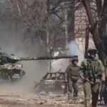 Russian tank firing at Ukrainian positions during the Battle of Mariupol
