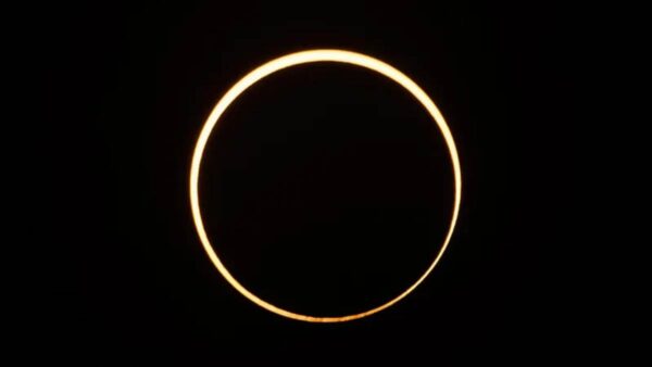 The moon moves in front of the sun in a rare "ring of fire" solar eclipse as seen from Singapore on December 26, 2019.
