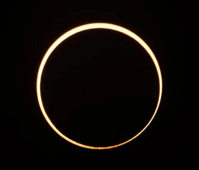 The moon moves in front of the sun in a rare "ring of fire" solar eclipse as seen from Singapore on December 26, 2019.