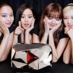 BLACKPINK with their Red Diamond Creator Award for surpassing 100 million subscribers on YouTube.