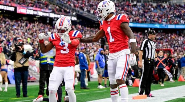 DeMario Douglas #3 of the New England Patriots celebrates with teammate Ja'Lynn Polk #1 after scoring a touchdown against the Houston Texans