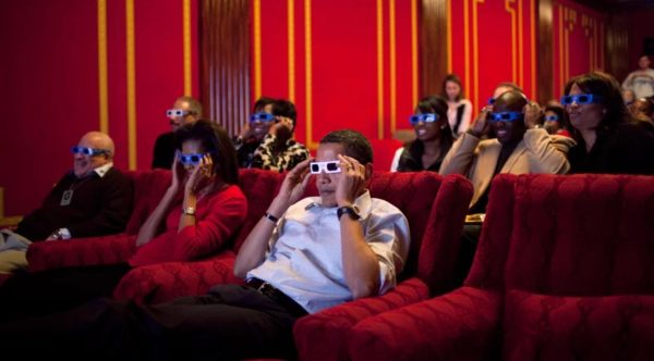 Former President Barack Obama and first lady Michelle Obama wear 3-D glasses during a Super Bowl party in the White House Family Theater in 2009.