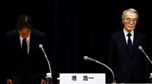 Fuji TV's president Koichi Minato (left) and chairman Shuji Kano (right) bowed during the press conference