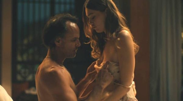 Walton Goggins undressing Aimee Lou Wood as they share an intimate moment in a scene from The White Lotus